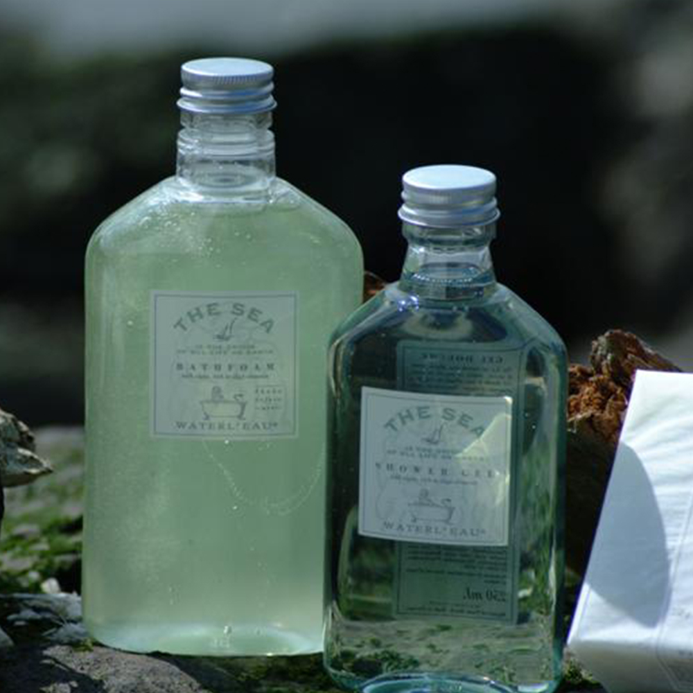 small glass flask like bottles filled with green liquid